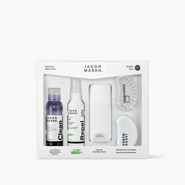 Jason Markk premium shoe care starter box with cleaning solution, repellant spray, brushes, and microfiber towel.