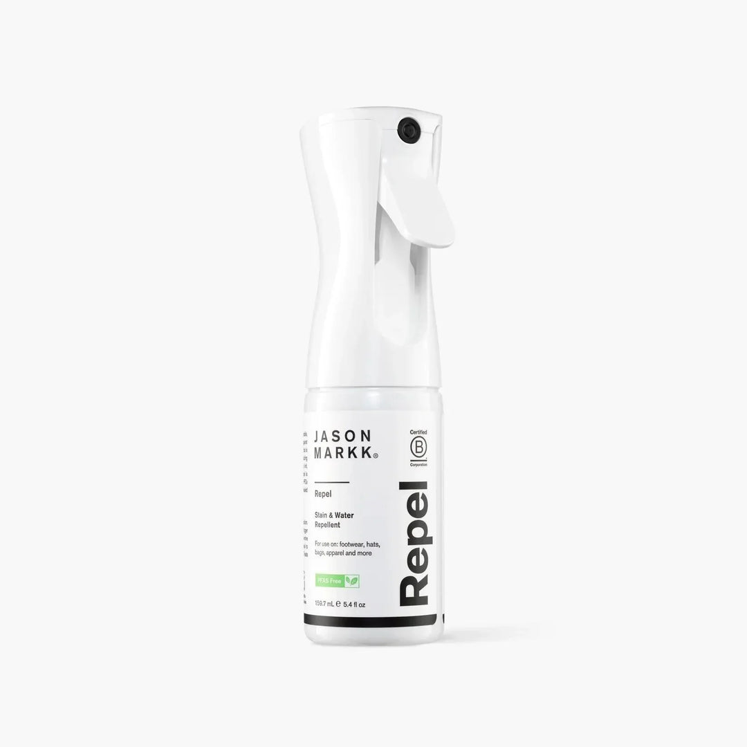 Jason Markk Repel spray bottle for stain and water repellent on gray background.