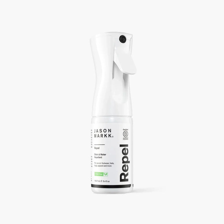 Jason Markk Repel spray bottle for stain and water repellent on gray background.