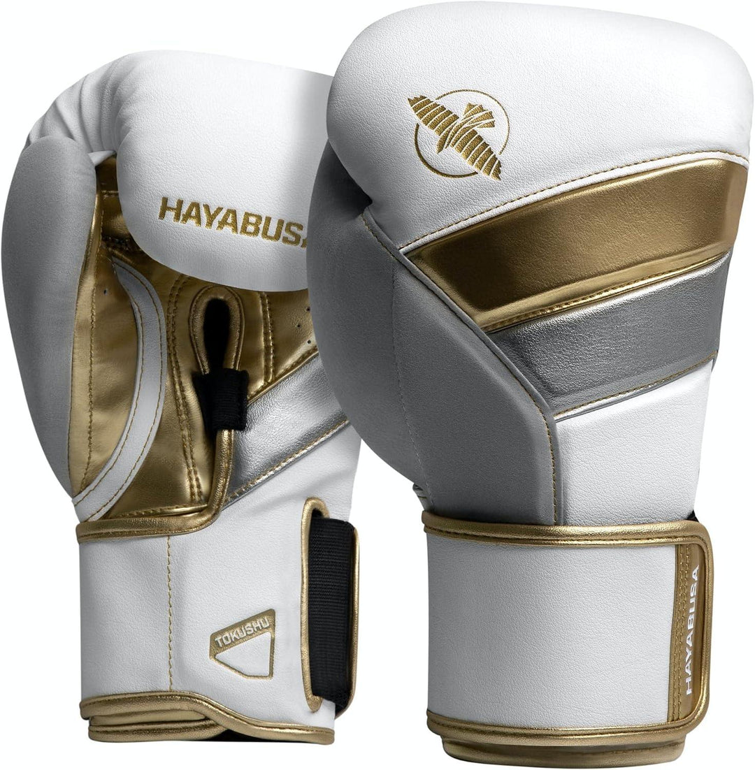 White, gold, and silver Hayabusa boxing gloves with wrist support on a white background.