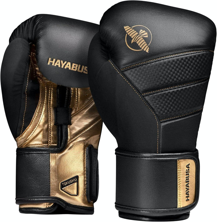 Black and gold Hayabusa boxing gloves with wrist support, pro training equipment