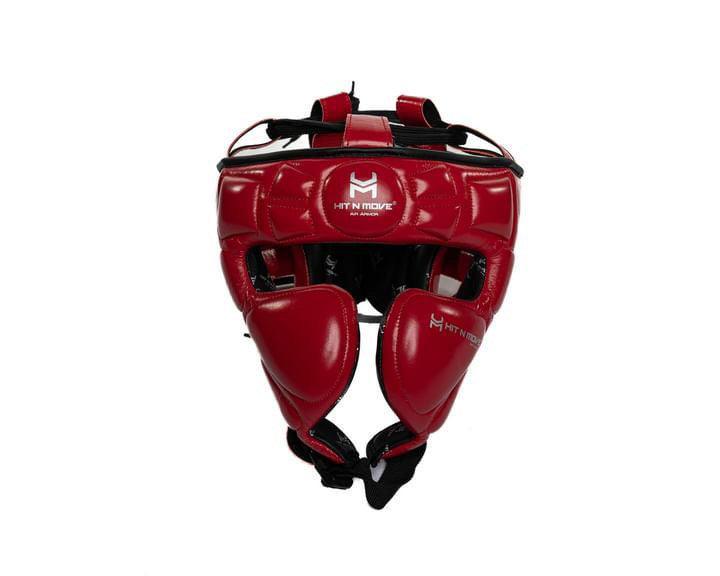 Red boxing headgear with padding and adjustable straps for sparring protection