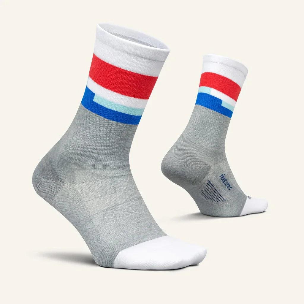 Gray athletic socks with white, red, and blue stripes, moisture-wicking design