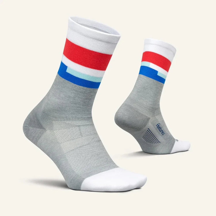 Gray athletic socks with white, red, and blue stripes, moisture-wicking design