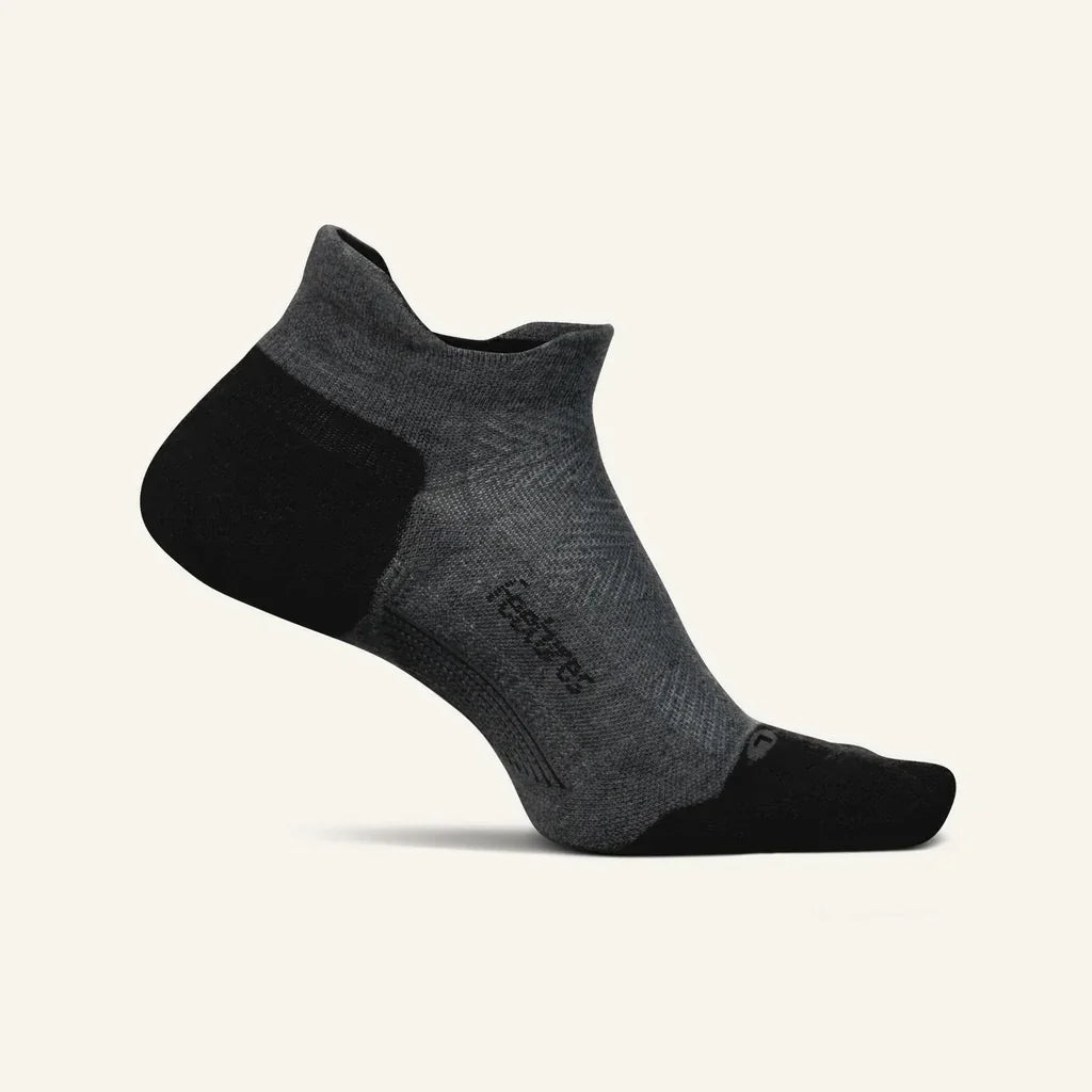 Gray and black low-cut athletic sock with reinforced heel and toe on neutral background