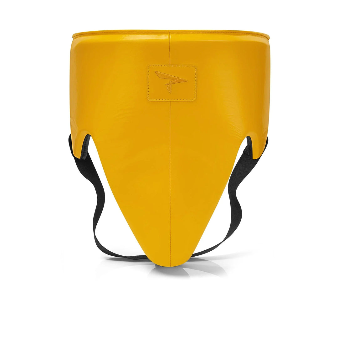 Yellow boxing groin guard with black straps, front view, protective sports equipment