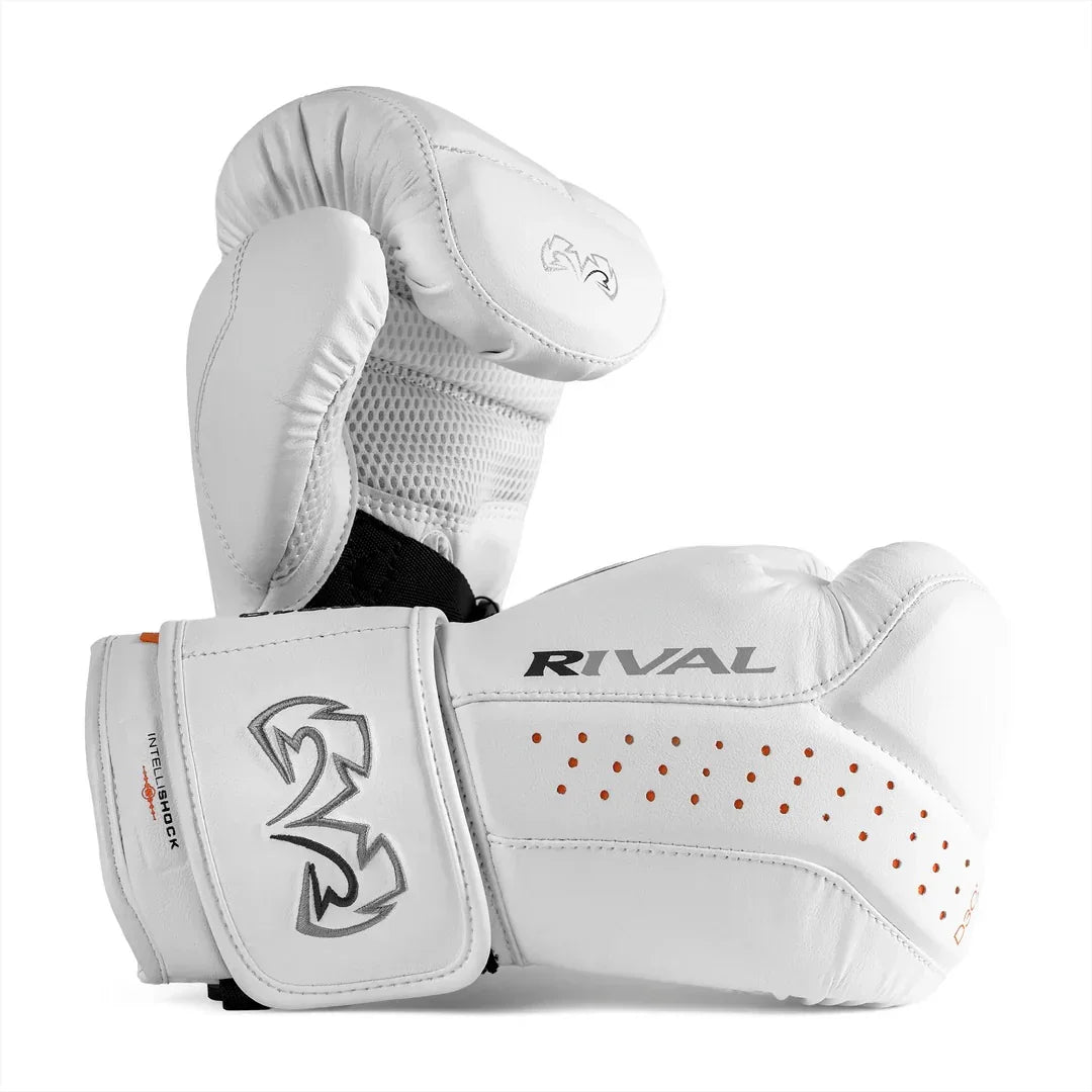 White Rival boxing gloves with mesh panel, orange ventilation holes, and wrist support.