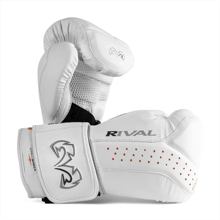 White Rival boxing gloves with mesh panel, orange ventilation holes, and wrist support.