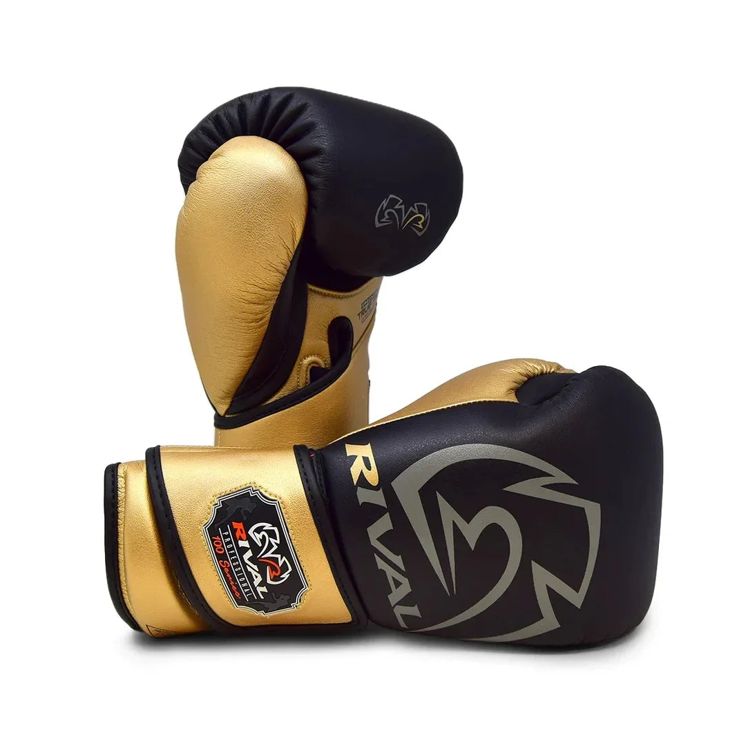 Black and gold Rival boxing gloves with logo, pro-grade training equipment on white background