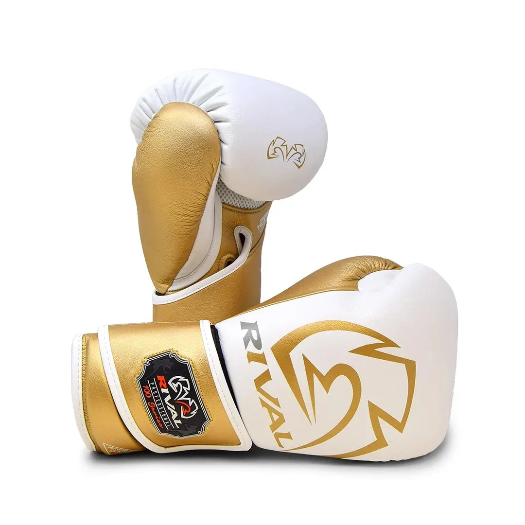 White and gold Rival boxing gloves for training or sparring, pro-grade boxing equipment