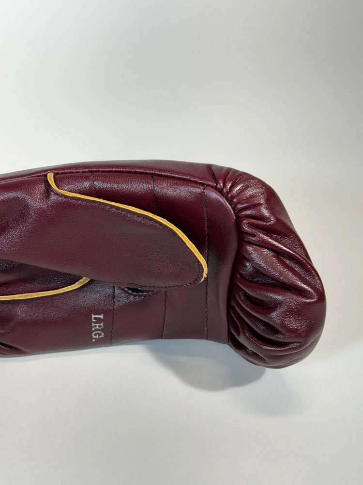 Red leather boxing glove with yellow trim on white background, LRG size visible