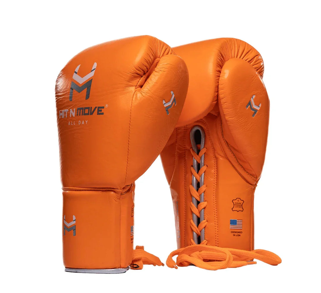 Orange lace-up pro boxing gloves with Hit N Move logo and USA flag symbol