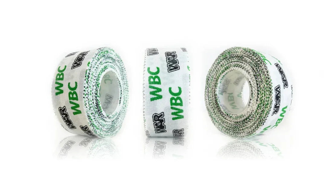 Three rolls of white boxing hand wrap tape with WBC and WAR logos on a white background.
