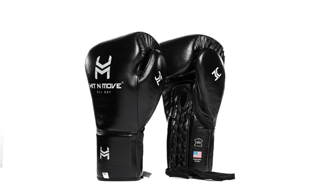 Black leather boxing gloves with lace-up closure and white logo, professional gear