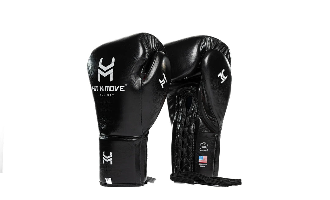 Black leather boxing gloves with lace-up design and printed white logos on a white background.