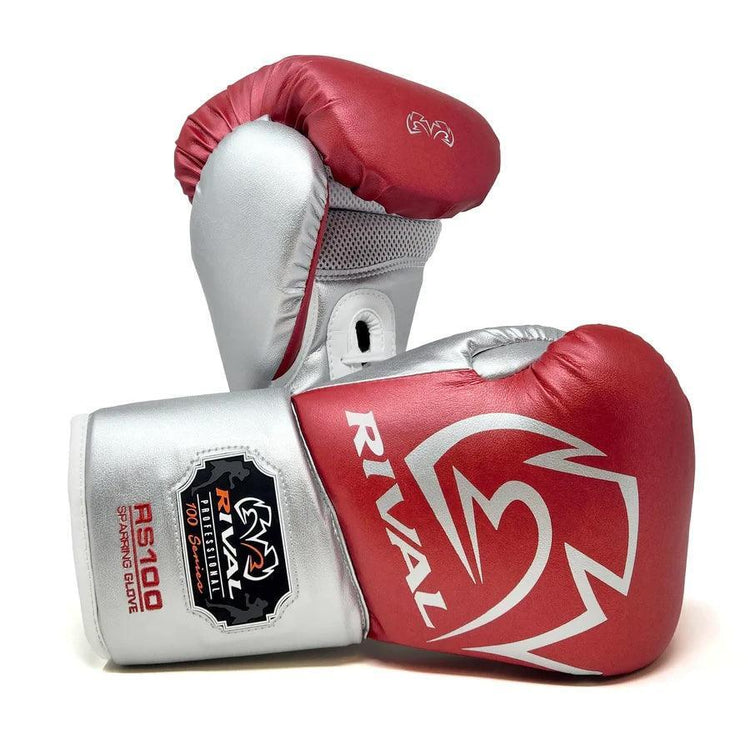 Red and silver Rival RS100 boxing gloves with mesh palm, designed for sparring use.