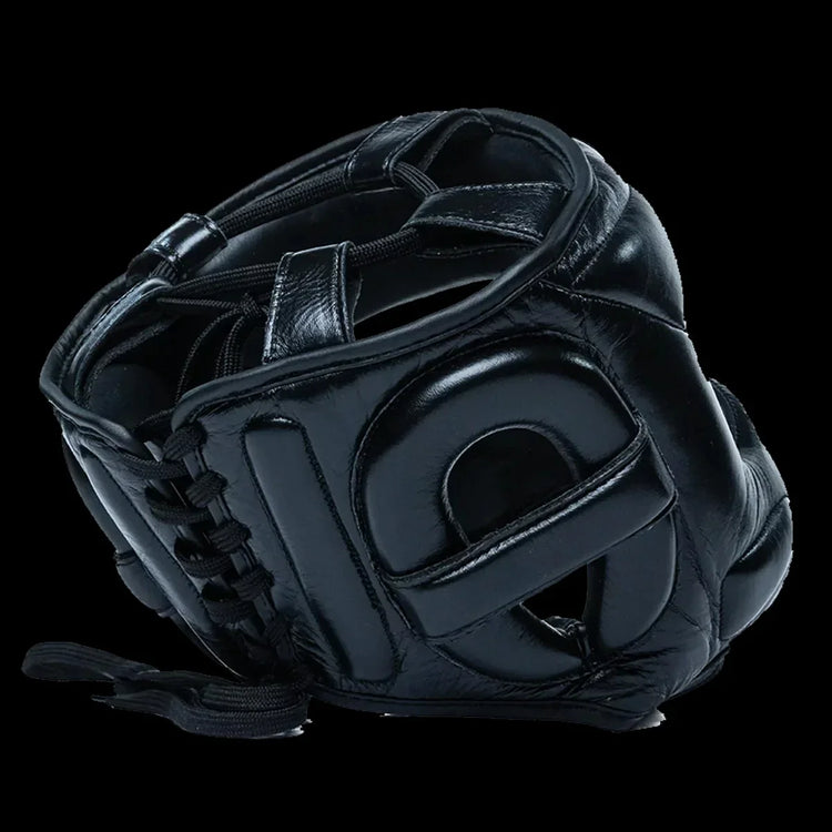 Black leather boxing face saver headgear with padded protection on a black background