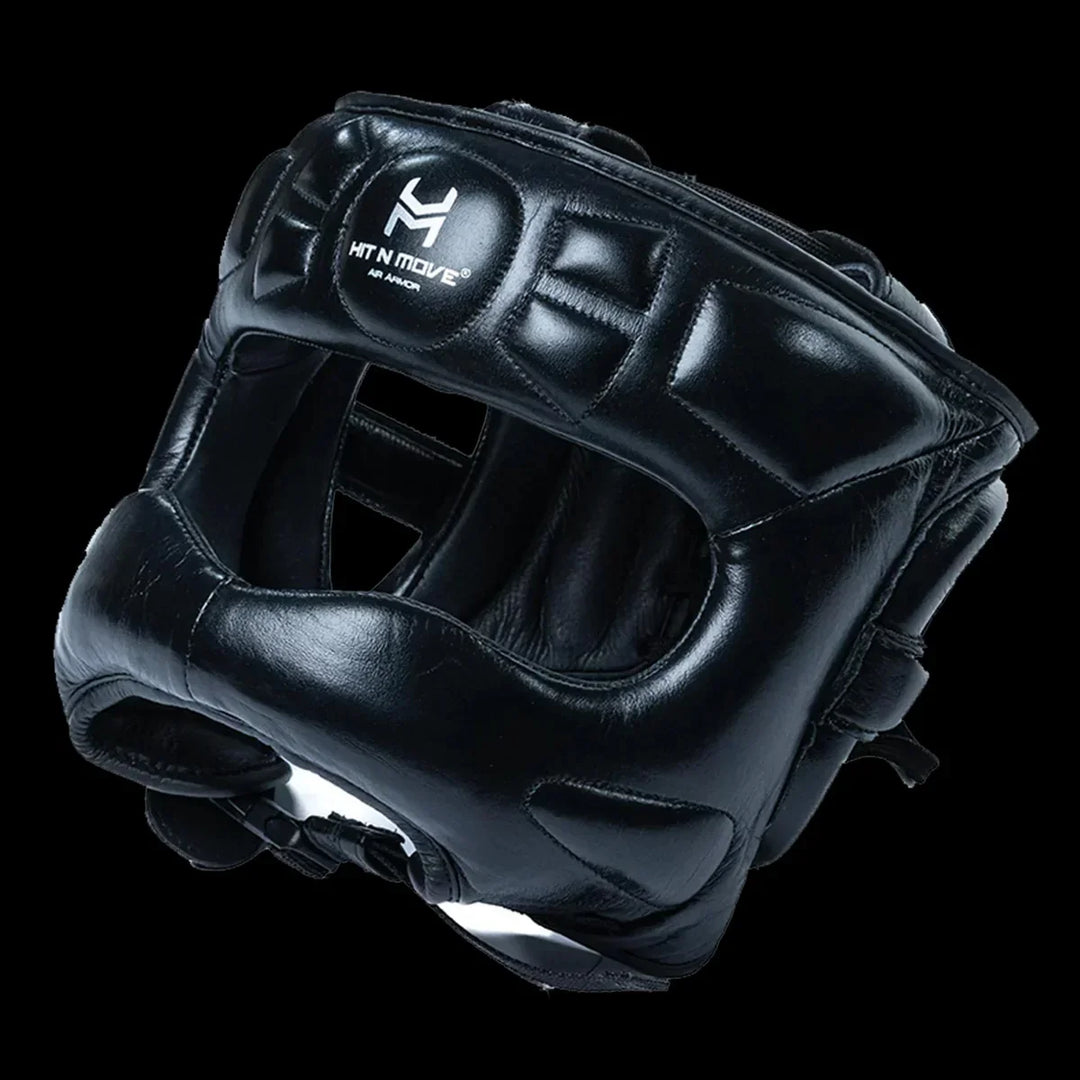 Black boxing headgear with face saver design and visible Hit N Move logo on front.