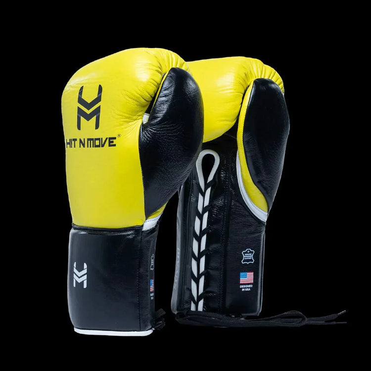 Yellow and black lace-up boxing gloves, pro-grade leather, on a black background.