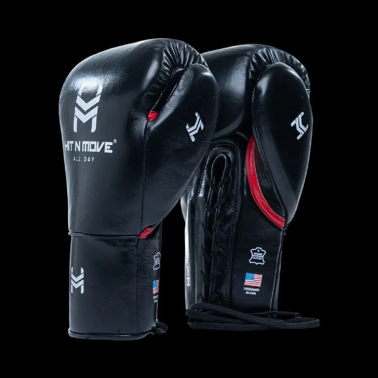 Black leather boxing gloves with lace-up cuffs, white logos, and red accents on a black background