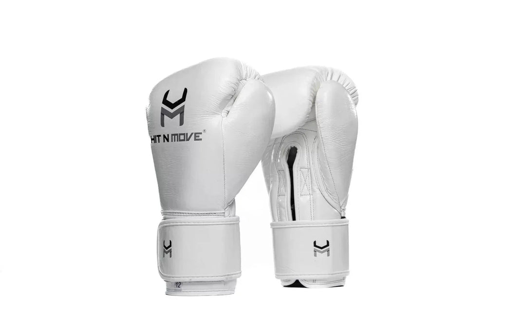 White leather boxing gloves with hook and loop closure, Hit N Move logo visible, isolated on white background