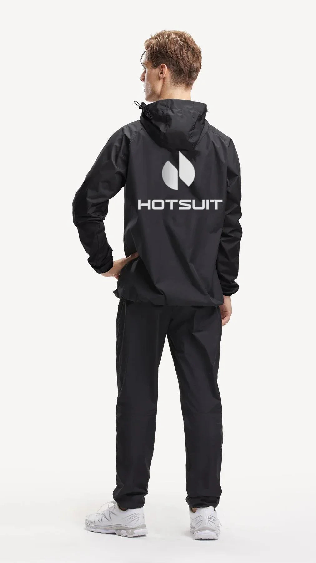 Man wearing black HOTSUIT long sleeve sauna suit and matching pants, back view