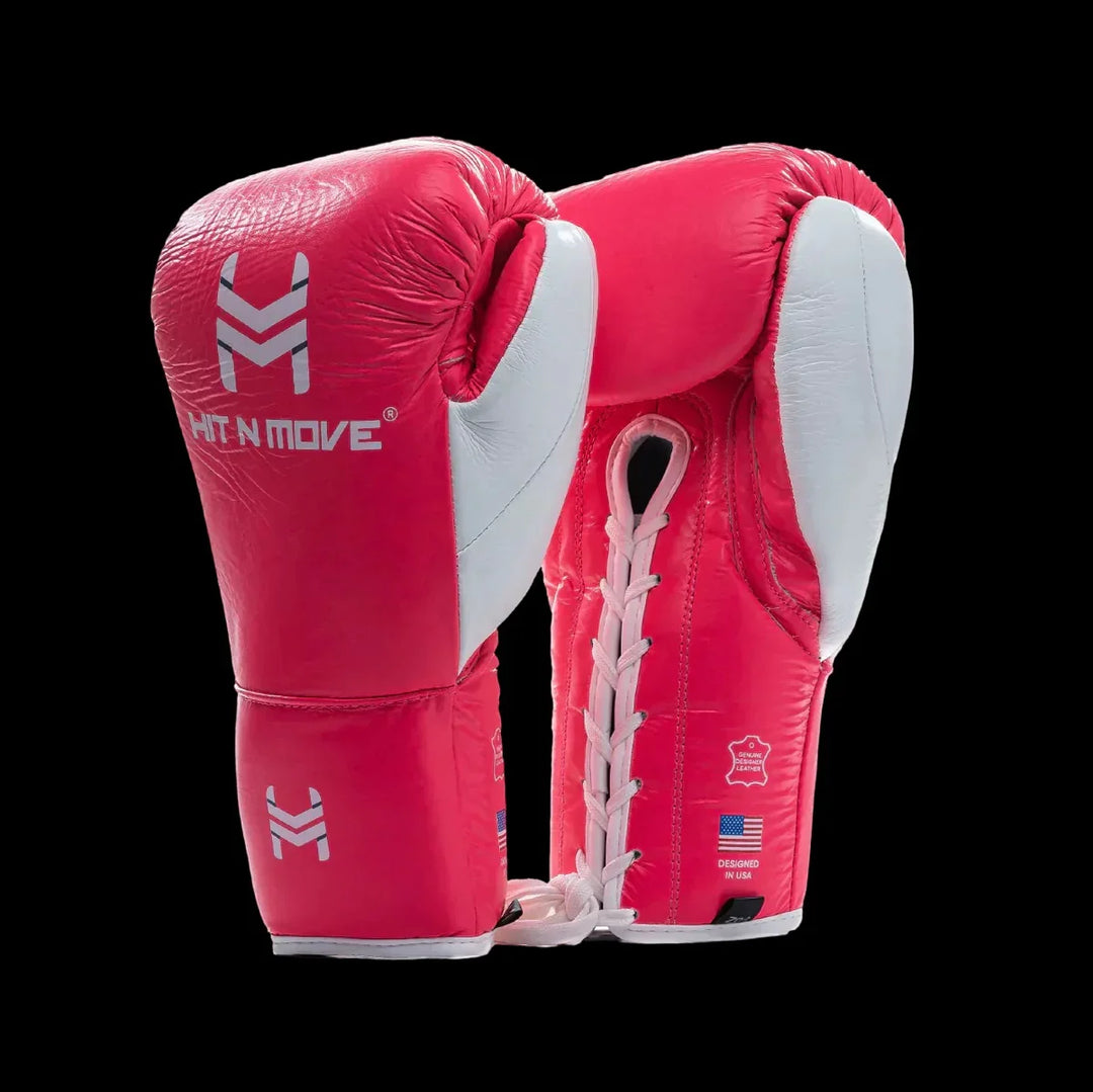 Red and white leather boxing gloves with lace-up closure and Hit N Move logo on black background