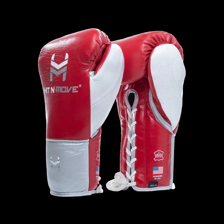 Red and white lace-up boxing gloves with leather finish on black background