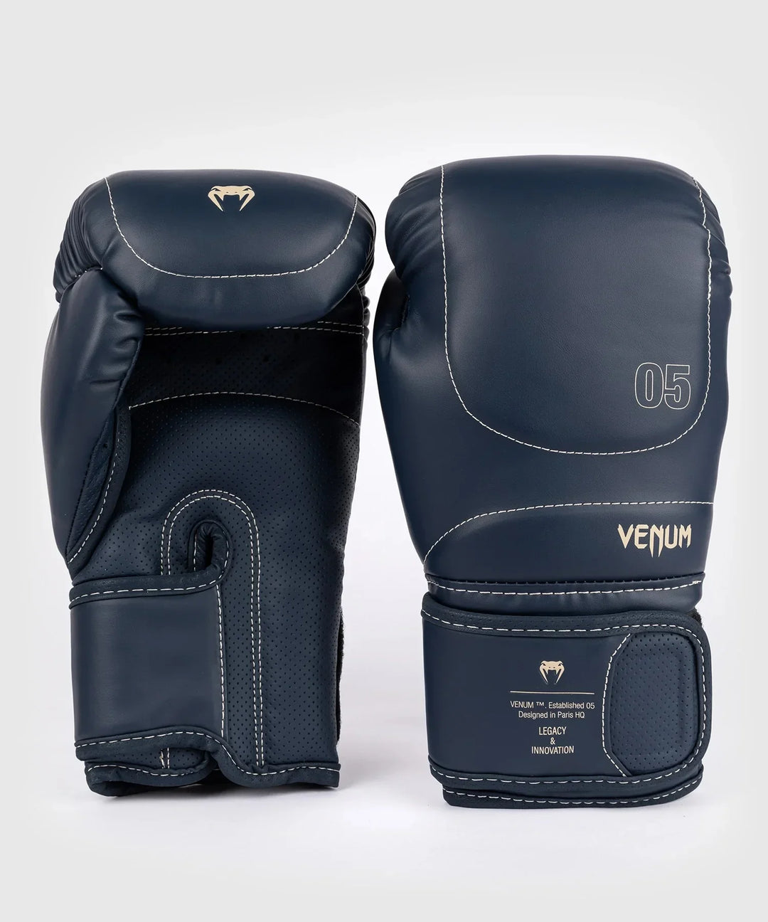 Pair of Venum dark blue boxing gloves with gold logo and wrist straps, pro-grade equipment