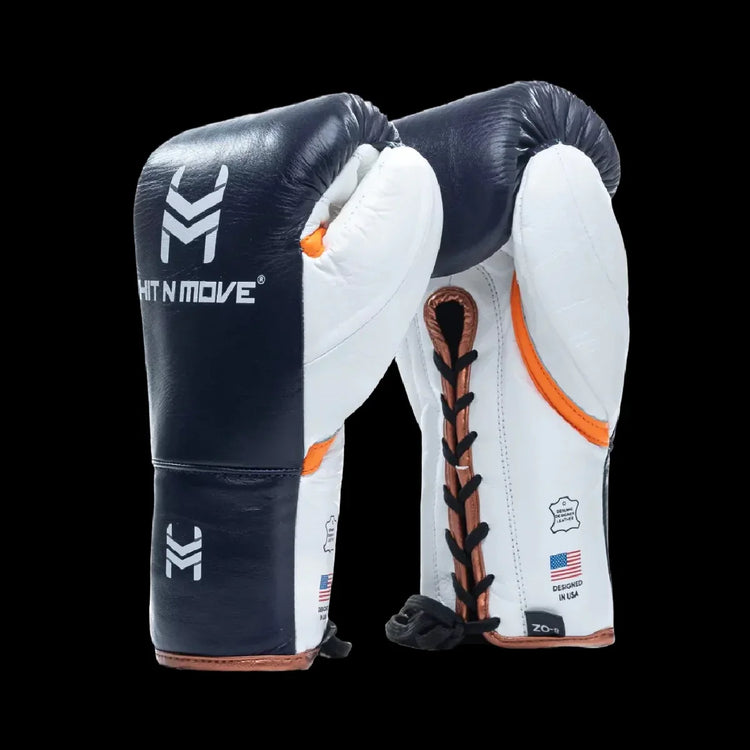 Pro-grade white and navy boxing gloves with lace-up design on black background