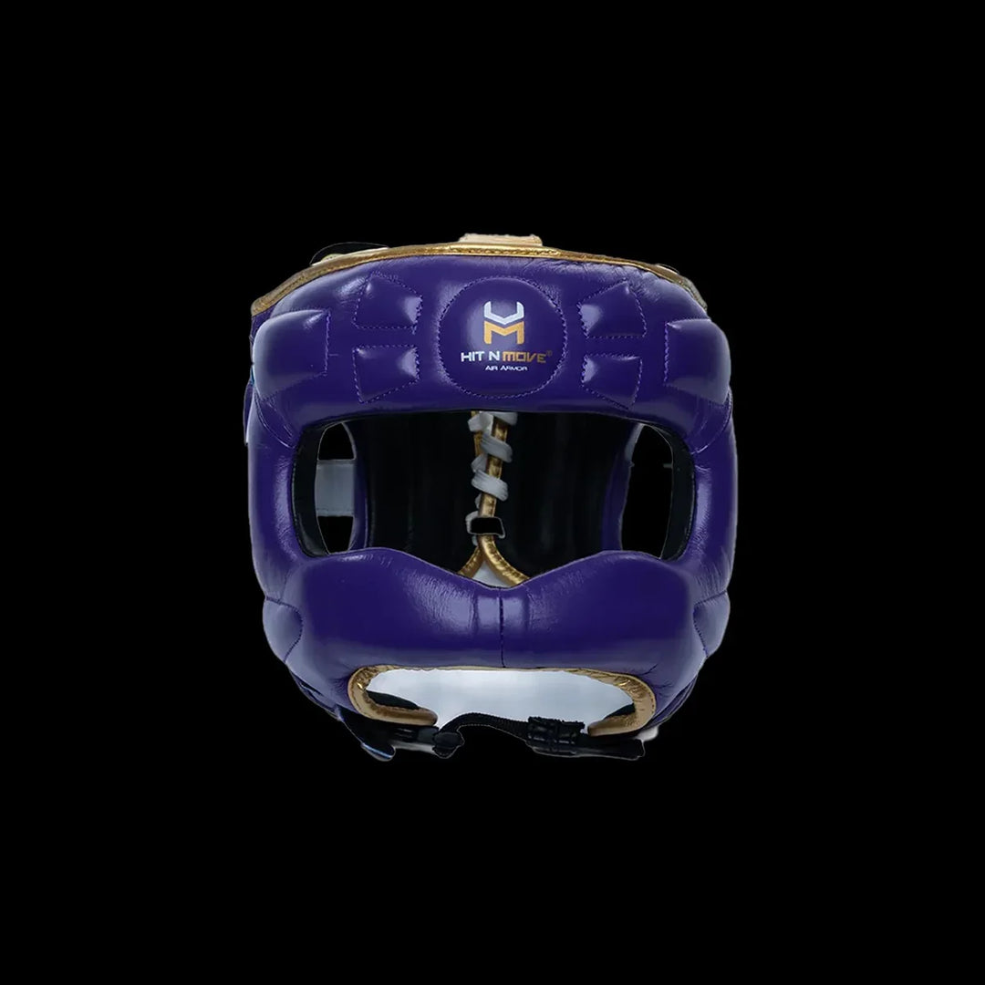 Purple leather boxing headgear with gold trim and Hit N Move logo, front view, on black background