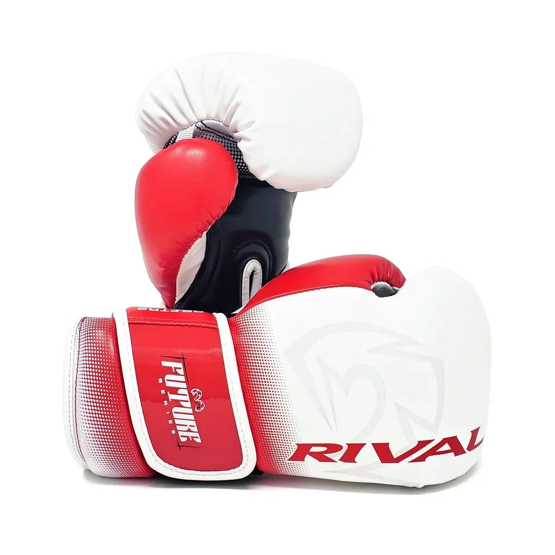 Red and white Rival boxing gloves with velcro strap and padded knuckles on white background
