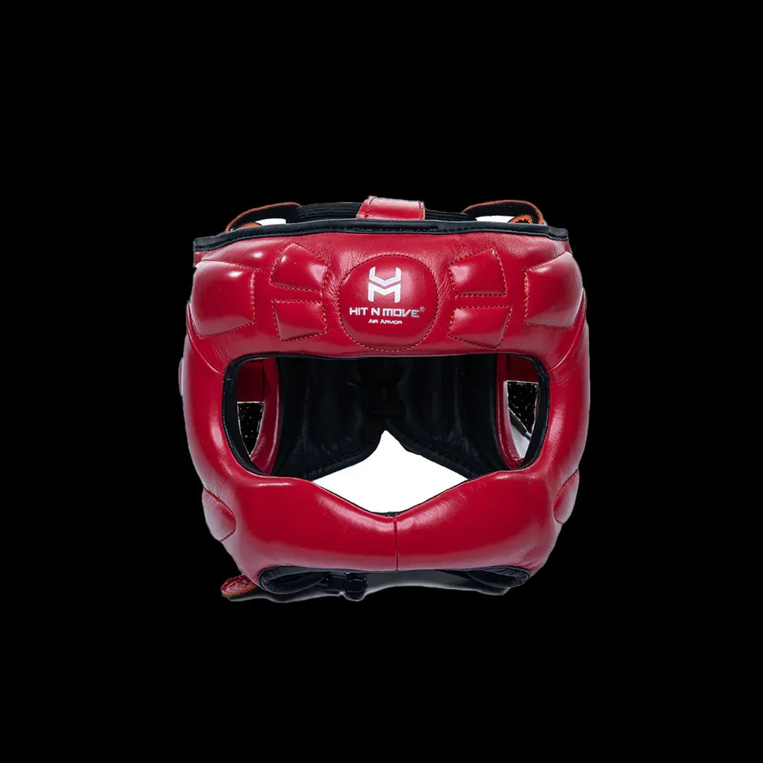 Red boxing headgear with facial protection and white Hit N Move logo, isolated on black