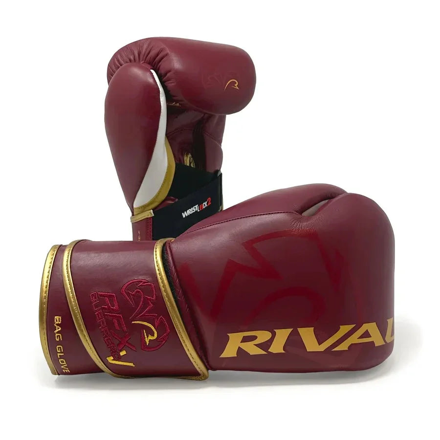 Burgundy and gold boxing gloves with Rival logo, pro-grade training equipment