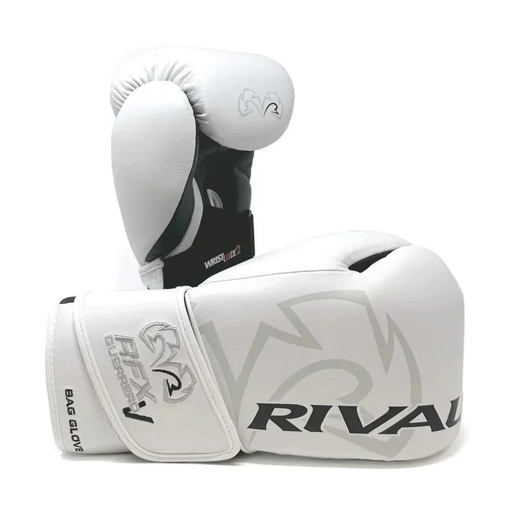 White and black Rival boxing gloves with wrist support and bold logo, pro-grade training gear