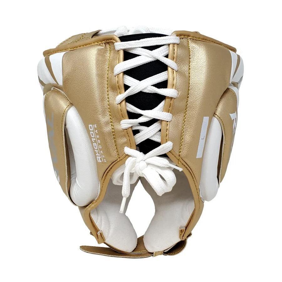 Gold and white lace-up boxing headgear with padded ear protection, pro-grade equipment