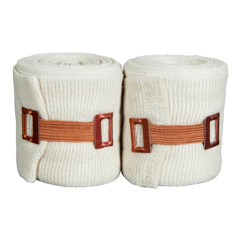 Pair of rolled white cotton boxing hand wraps with brown metal fasteners
