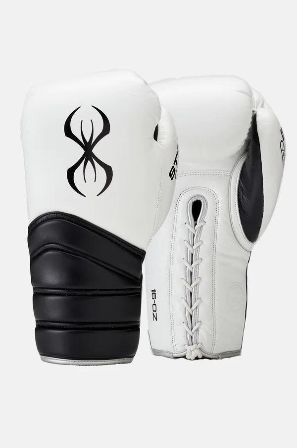 White and black lace-up boxing sparring gloves with bold black tribal logo, 16 oz size